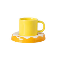 Set of coffee cups with donut holder